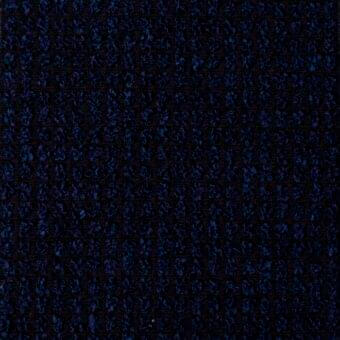 Navy blue bouclé fabric texture with a dense, looped pile and mottled tonal variations, exhibiting a nubby, irregular surface.